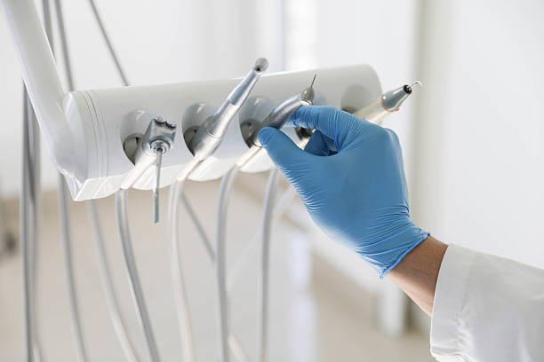 Professional Tooth Extraction technician working in Rock Island, IL